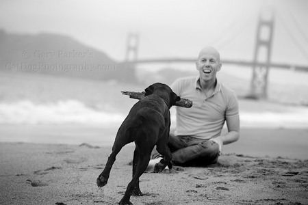 MICKEY, A THERAPY DOG, RUNS TO ARJAN, HIS HUMAN, AS FOG ENSHROUDS THE GOLDEN GATE BRIDGE...